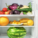 Shelfs in the refrigerator with vegetables.