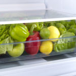 Fridge drawer full fo vegetables.