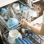 A dishwasher loaded with dishes.