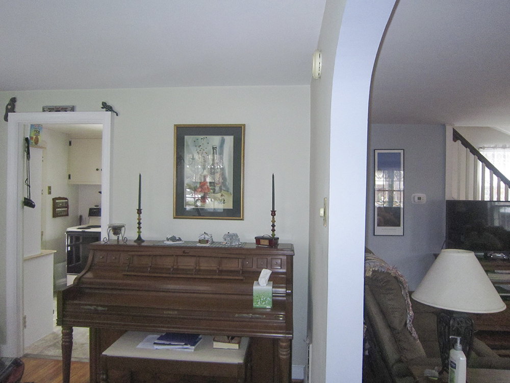 A kitchen viewed through a doorway.