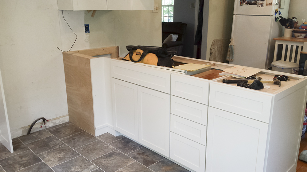 A kitchen in the process of being remodeled.