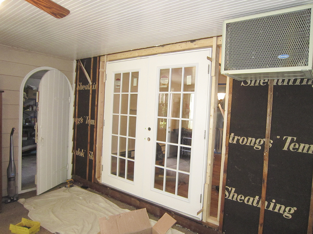 A doorway and wall being installed.