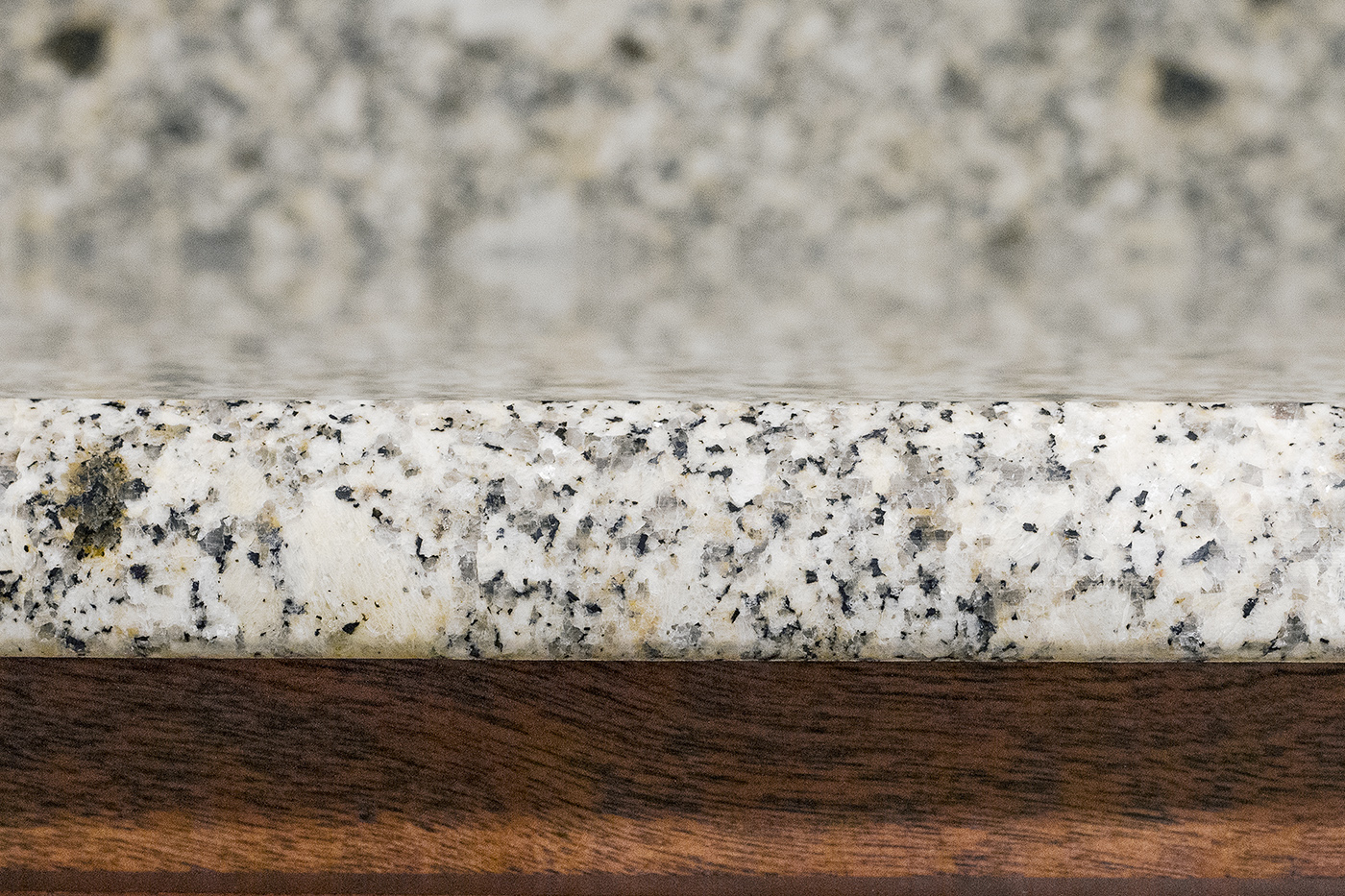 A close up of a granite counter top.