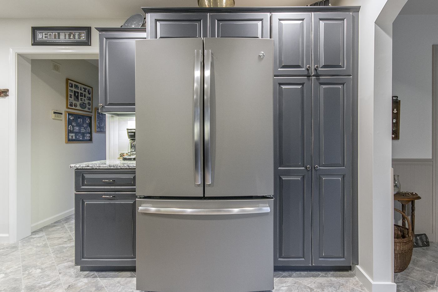 A refrigerator and cabinets.