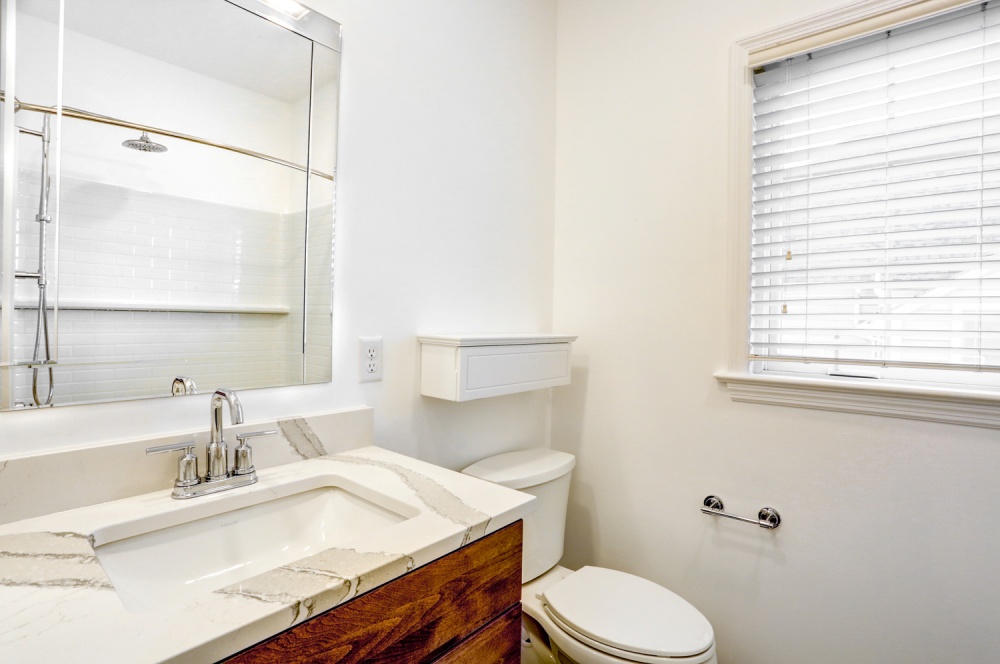 newly remodeled bathroom sink and toilet