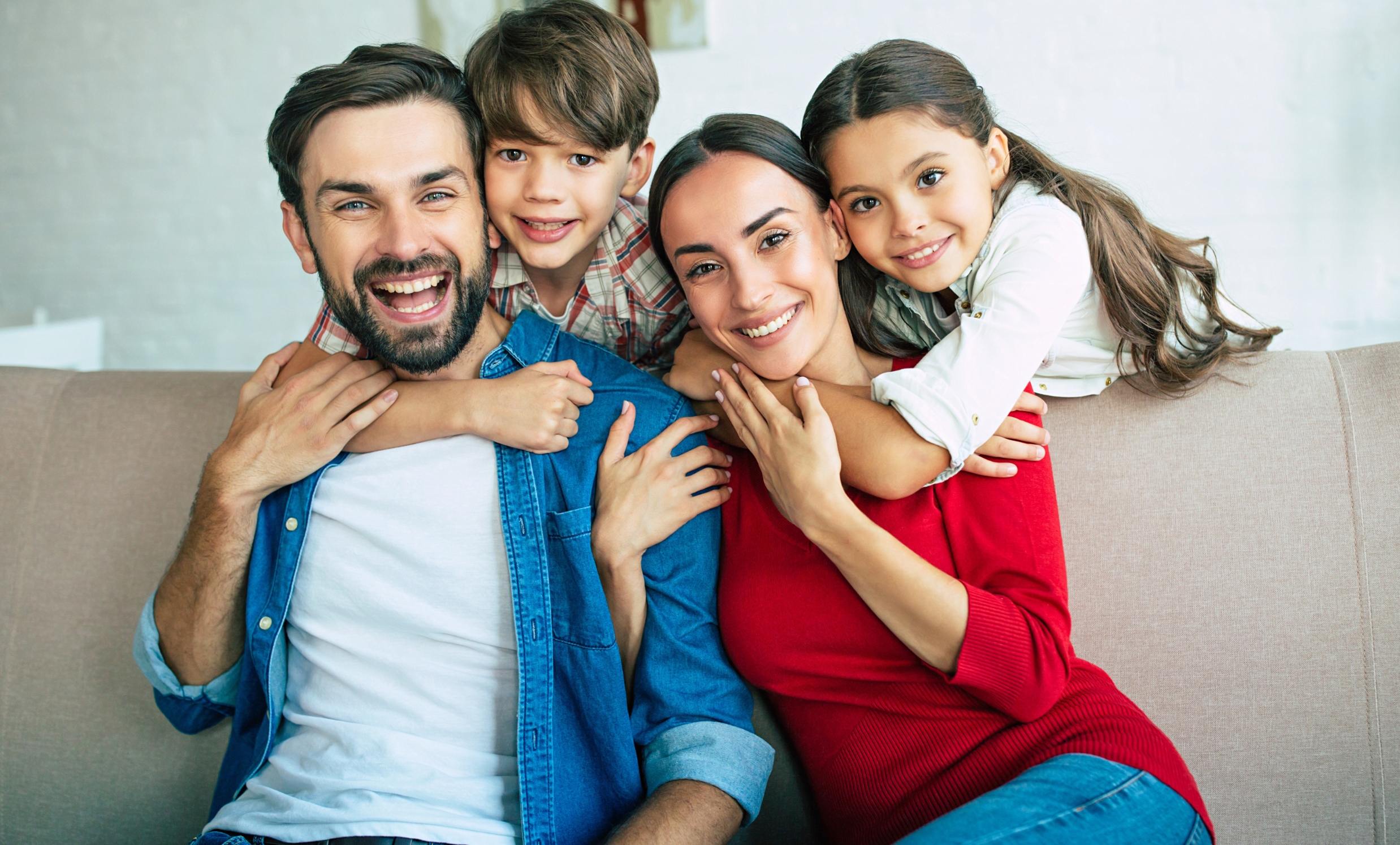 Happy family in comfortable home provided by Brubaker their trusted home service company.